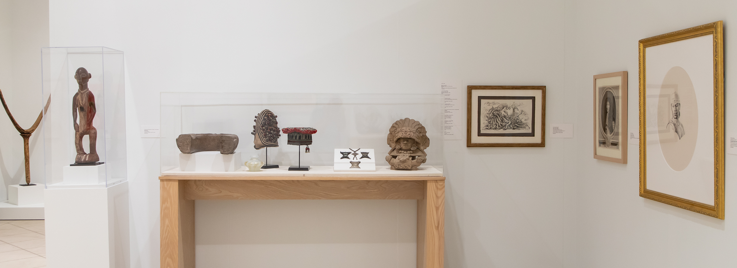 A variety of two and three dimensional artworks displayed in a gallery