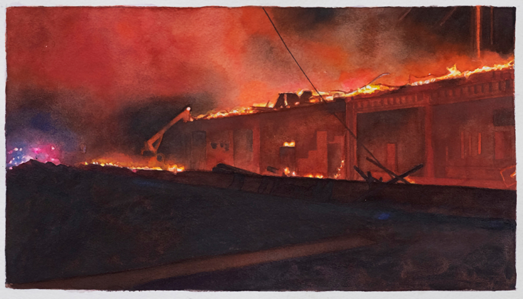 A structure on fire at night