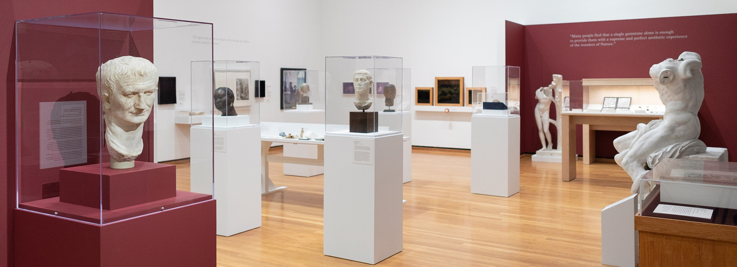 A museum gallery with sculpture and other artworks