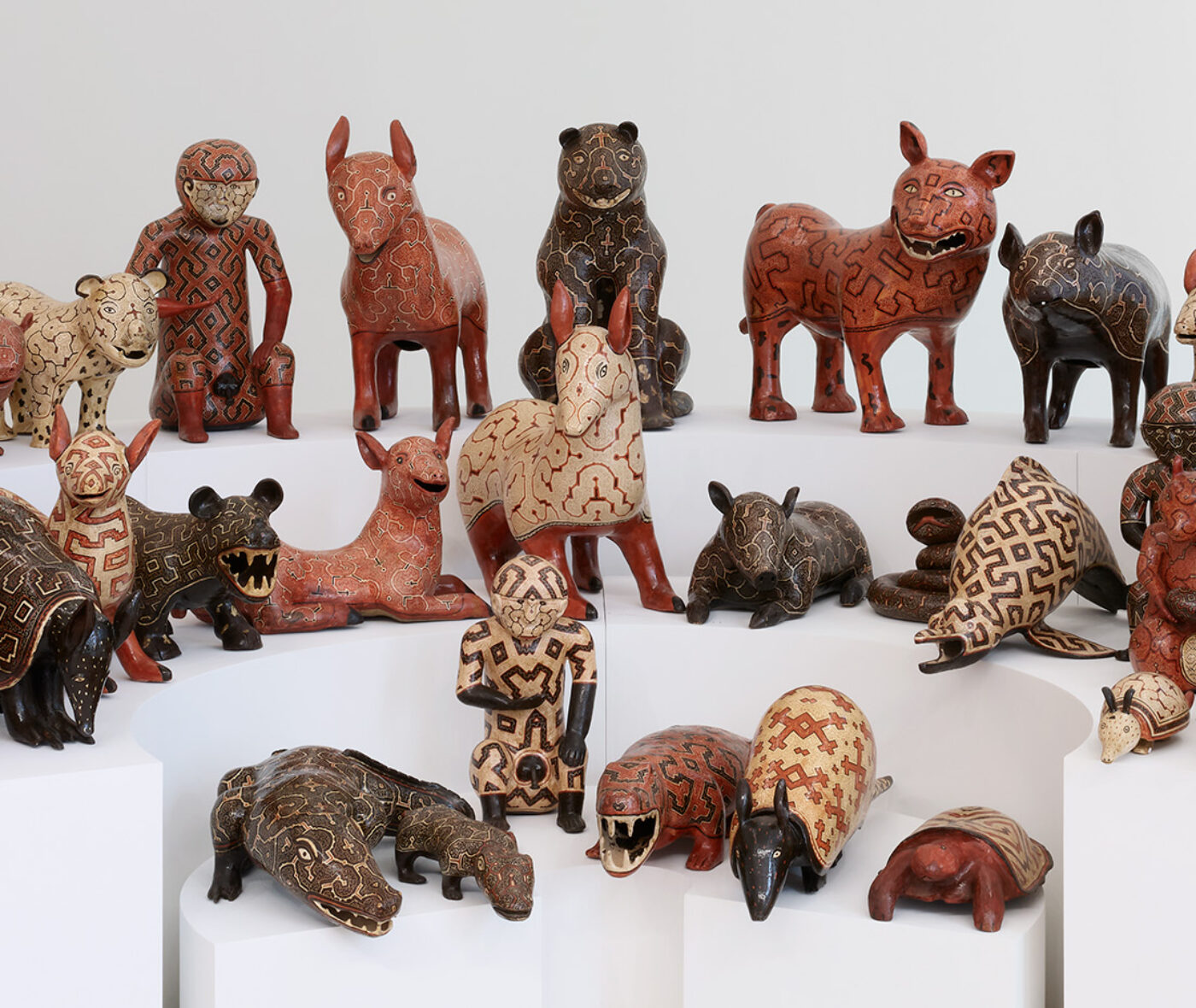 Three rows of different ceramic animal figures