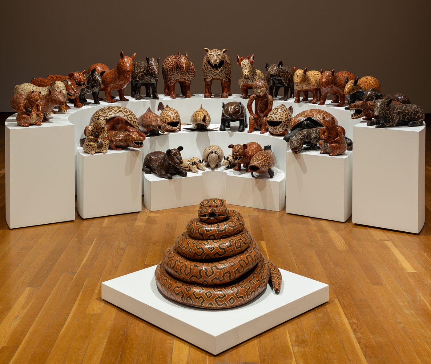 Four rows of different ceramic animal figures