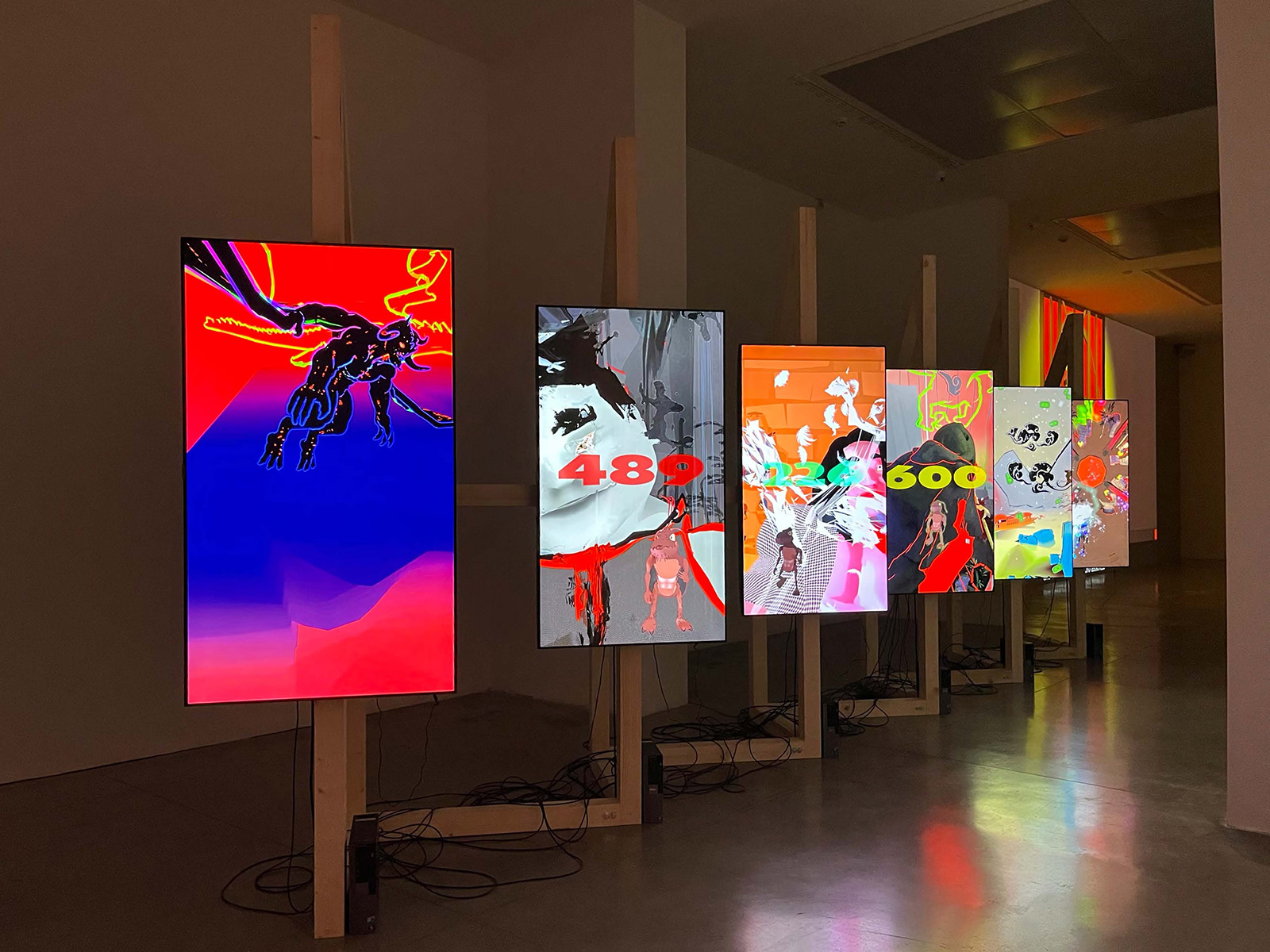 Brightly colored digital screens arranged in a gallery