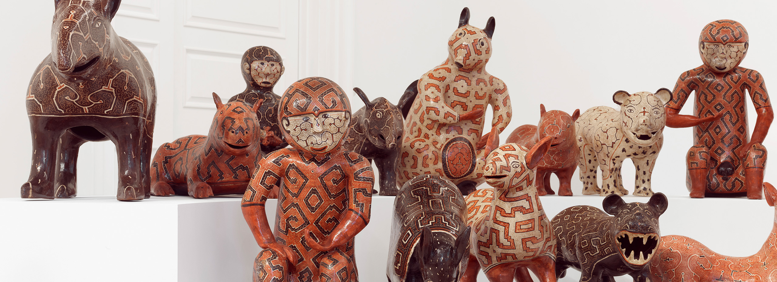 Two rows of different ceramic animal figures