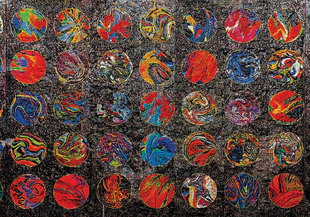 A even grid of colorful circles fills a dark background