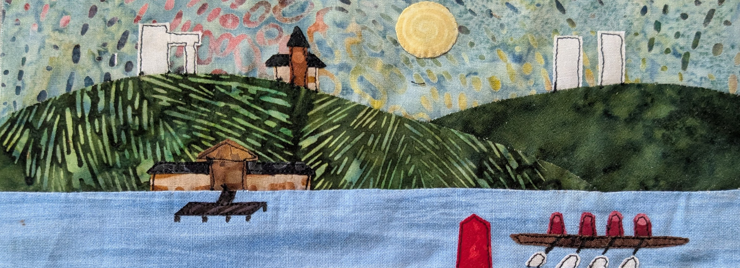 A quilted rendering of buildings on a hill and boats on a lake