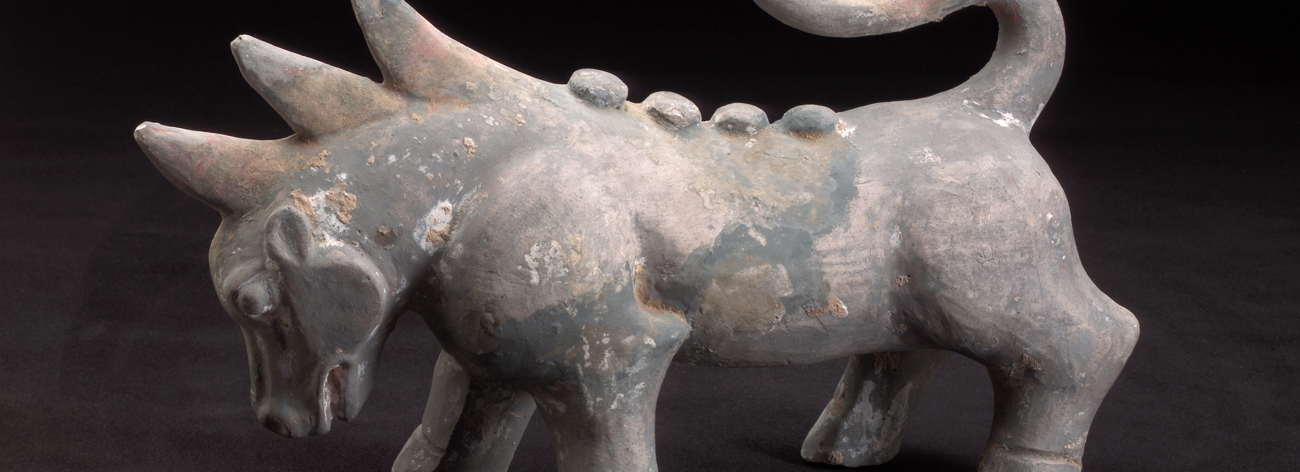 A stone sculpture of a dragon-like creature