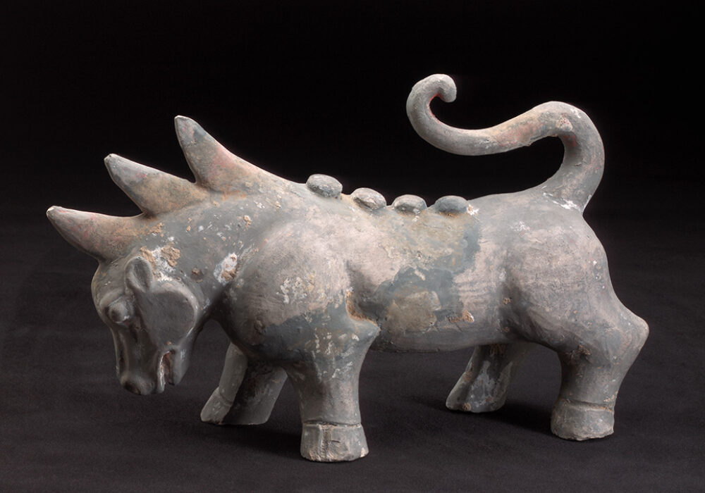 A stone sculpture of a dragon-like creature